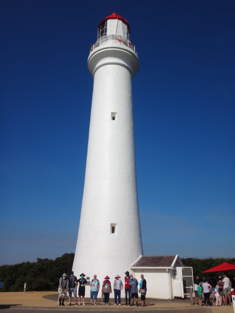 A group of travellers with diverse abilities at the Airey’s Inlet Lighthouse on the Great Ocean Road